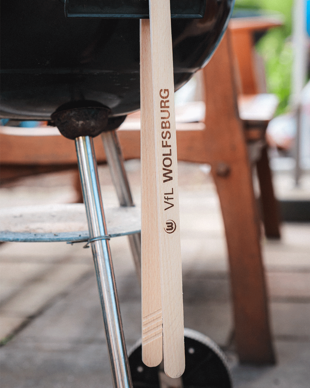 Barbecue tongs with bottle opener